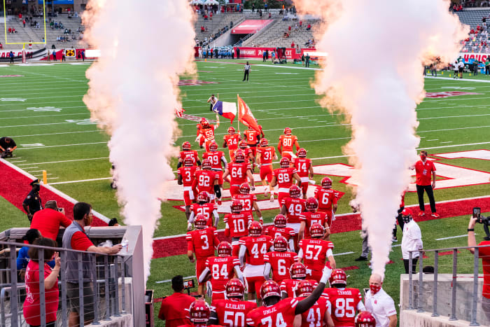 Houston football runs onto the field